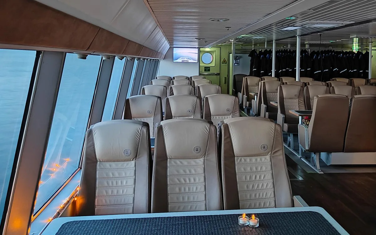 The heated cabin of a whale safari catamaran near Tromso